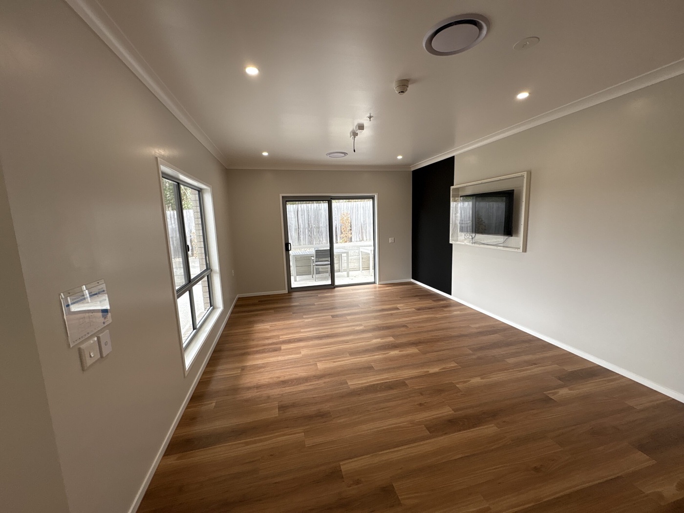 Open living zone with sliding doors to the outdoor patio