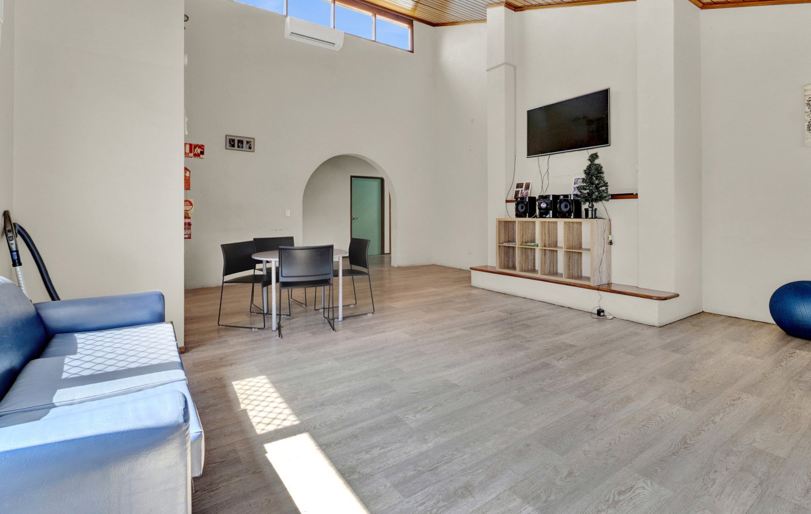 Bright, open living area with a soaring timber-lined ceiling