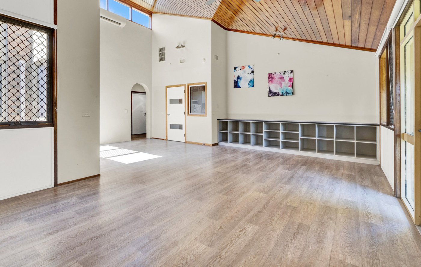 Open activity space with high cathedral ceiling and generous storage